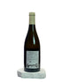 Wine bottle with label on a white surface