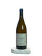 Wine bottle labeled 'Les Nourrissons' on a white surface with a neutral background