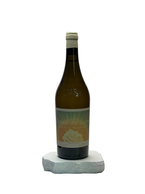 Wine bottle with a label on a white surface