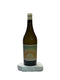 Wine bottle with a label on a white surface