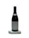 Bottle of wine with a label on a white surface
