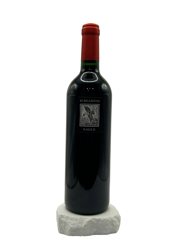 Wine bottle with red cap on a white background