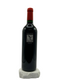 Wine bottle with red cap on a white background