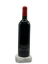 Red wine bottle with a red cap on a white background